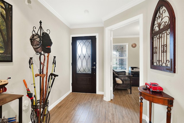 entryway with light hardwood / wood-style flooring and ornamental molding