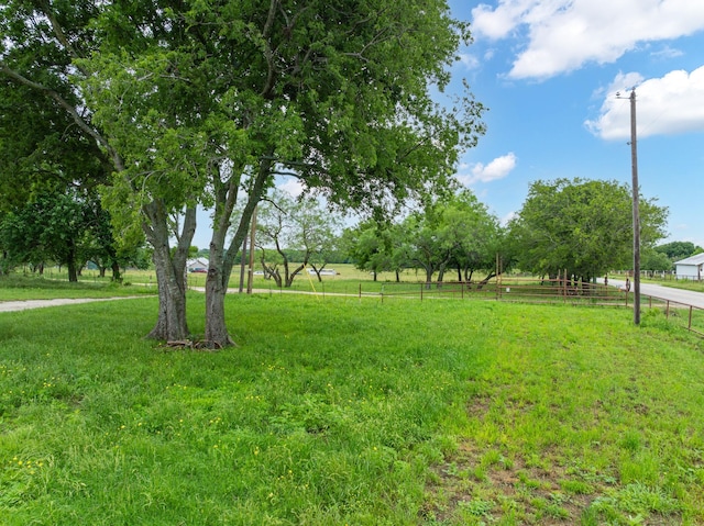 view of yard with a rural view