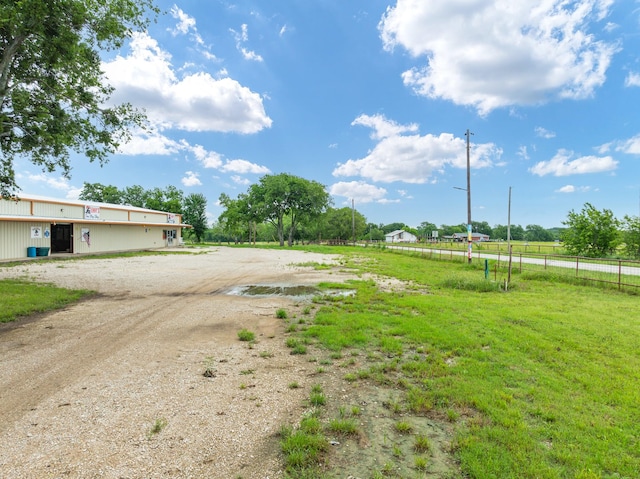 view of yard with a rural view