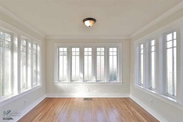 unfurnished sunroom featuring a wealth of natural light