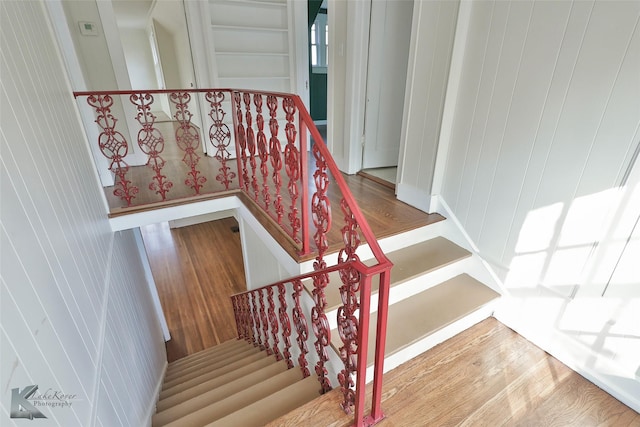 stairway featuring hardwood / wood-style flooring