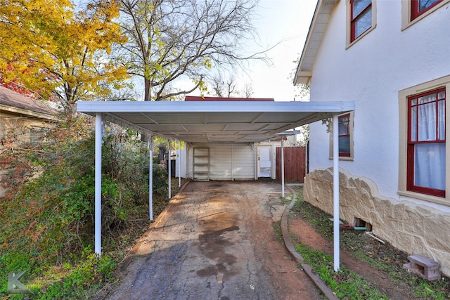 view of parking with a carport