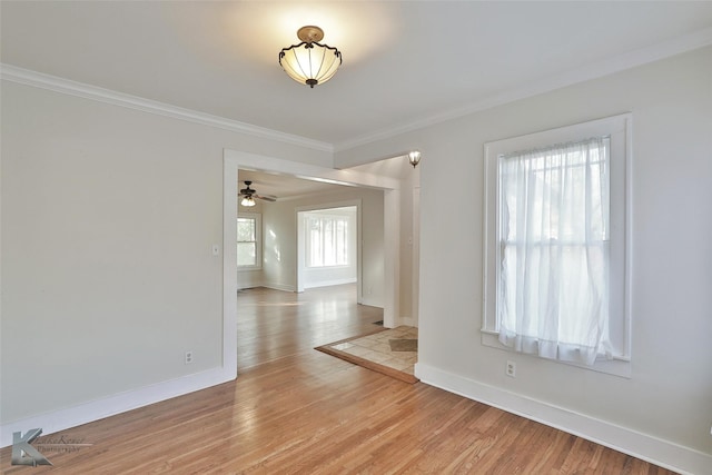 unfurnished room featuring crown molding, ceiling fan, and light hardwood / wood-style floors