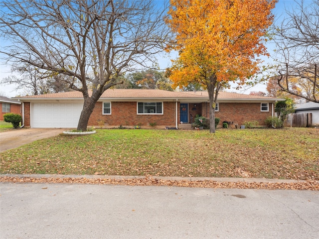 ranch-style house with a garage and a front yard