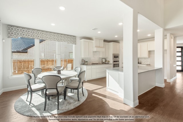 dining space with light hardwood / wood-style floors