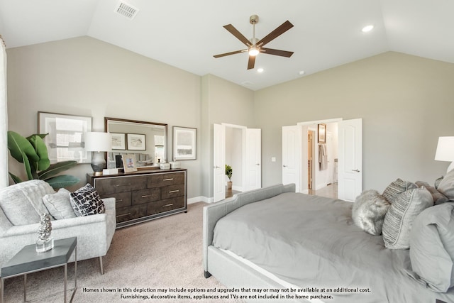 carpeted bedroom with ceiling fan and high vaulted ceiling