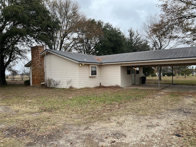 view of property exterior featuring a carport