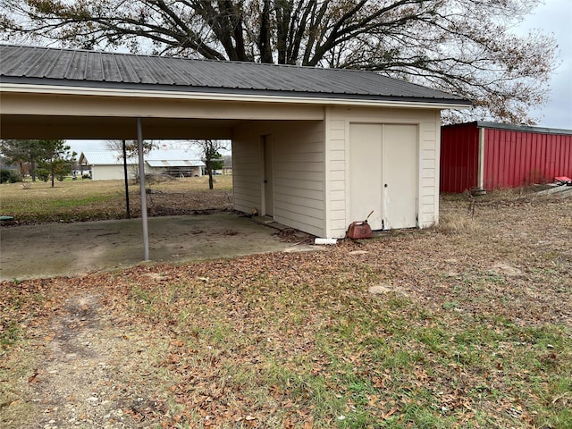 view of outbuilding featuring a carport