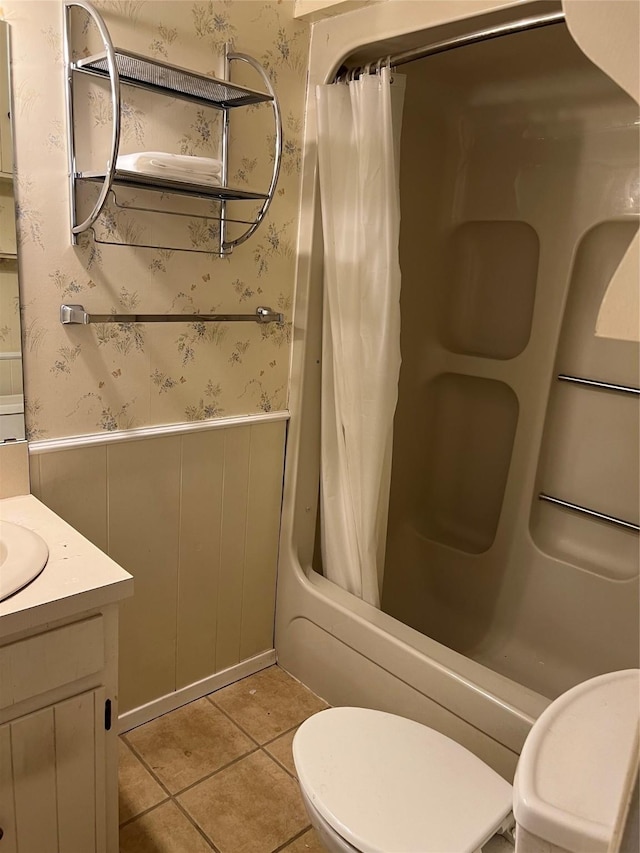 full bathroom featuring tile patterned floors, vanity, shower / bathtub combination with curtain, and toilet