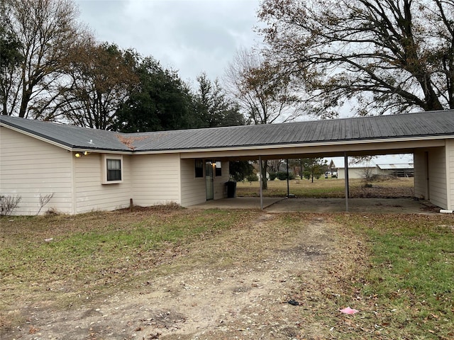 view of parking / parking lot with a carport