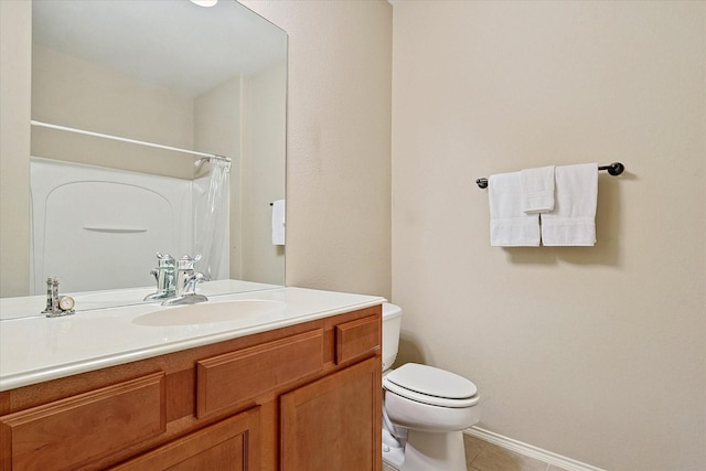 bathroom featuring toilet, a shower with curtain, vanity, and tile patterned floors