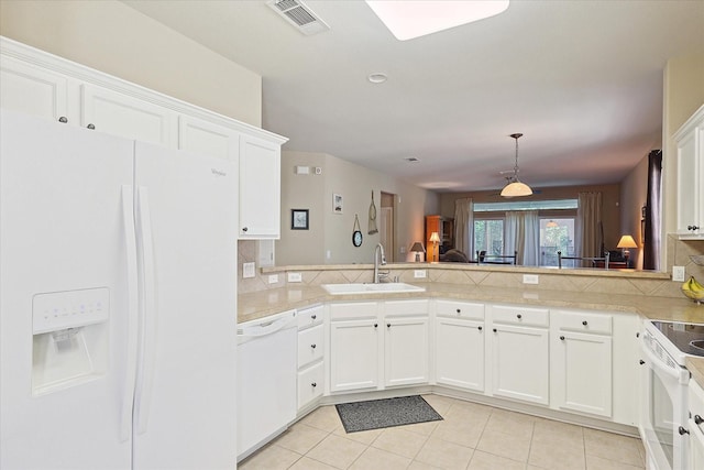 kitchen featuring kitchen peninsula, white cabinetry, sink, and white appliances