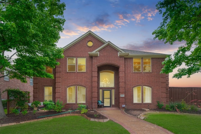 view of front of property with a lawn