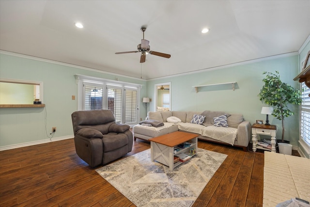 living room with ceiling fan, dark hardwood / wood-style flooring, crown molding, and vaulted ceiling