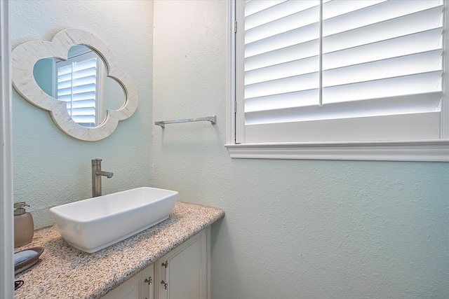 109 Crestwood Dr, Rockwall, TX 75087 - bathroom with vanity and a textured wall
