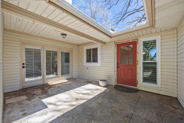 property entrance featuring a patio area