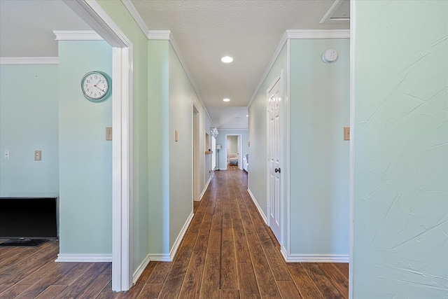 corridor featuring dark hardwood / wood-style flooring and ornamental molding