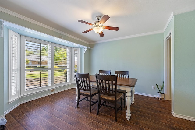 dining room with ceiling fan, crown molding, and dark wood-type flooring