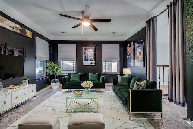 living room with ceiling fan, a healthy amount of sunlight, and ornamental molding