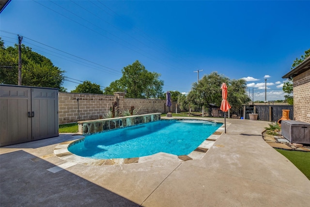 view of pool with pool water feature, a patio, a storage unit, and central air condition unit