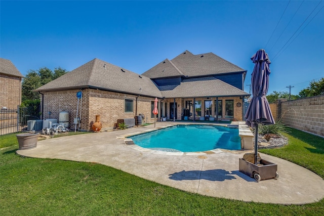 view of swimming pool with a lawn and a patio area