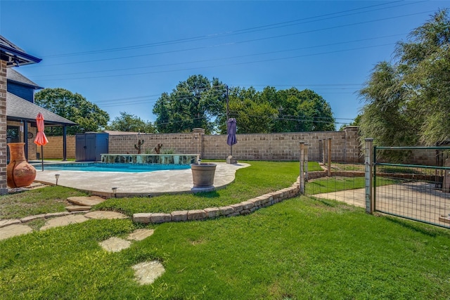 view of pool featuring pool water feature, a storage shed, and a lawn