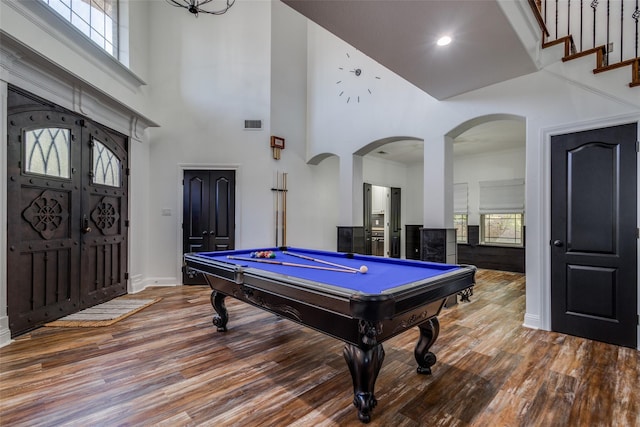 playroom featuring a towering ceiling, a healthy amount of sunlight, and billiards