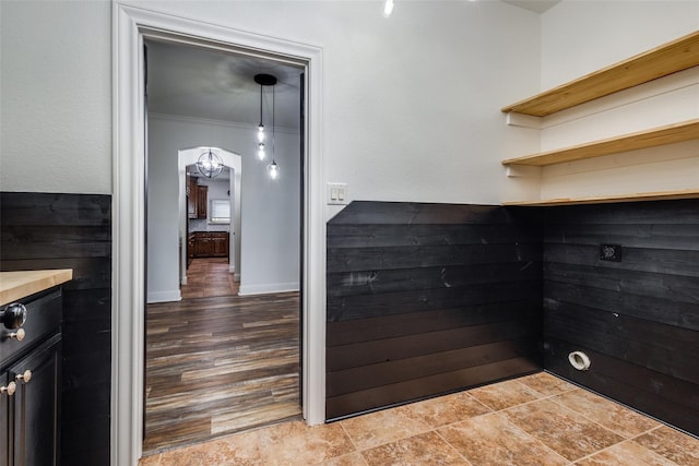 interior space with hardwood / wood-style floors and ornamental molding