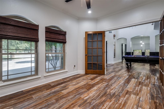 playroom with wood-type flooring, ceiling fan, crown molding, and billiards