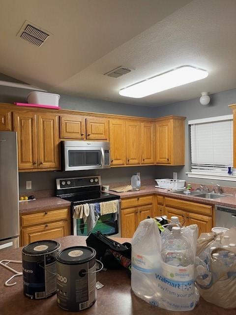 kitchen featuring stainless steel appliances and sink