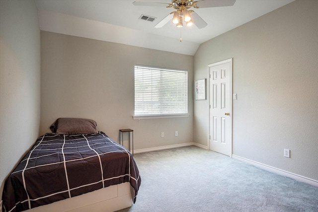 bedroom featuring ceiling fan, carpet floors, and vaulted ceiling