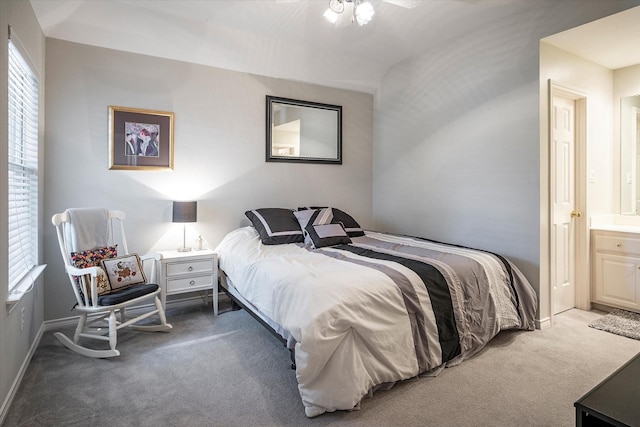 carpeted bedroom with ensuite bath