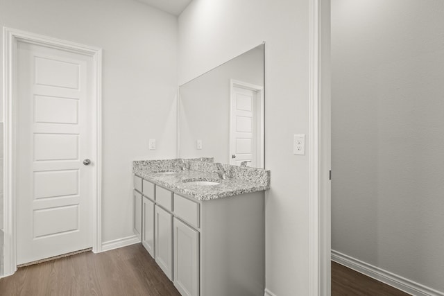 bathroom with vanity and hardwood / wood-style flooring