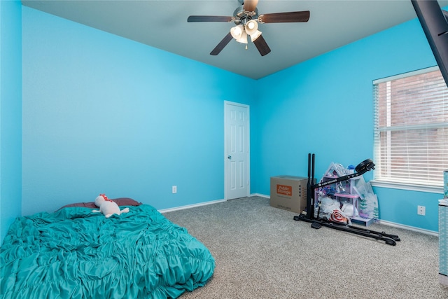 bedroom with ceiling fan and carpet floors