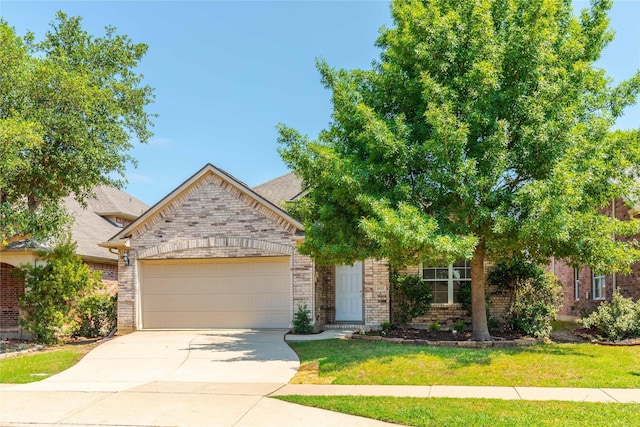 view of property hidden behind natural elements featuring a front yard and a garage