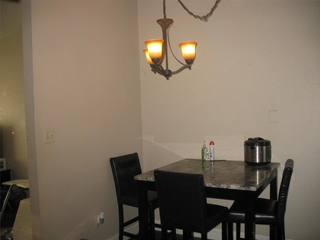 dining space featuring a chandelier