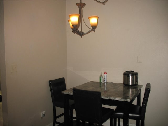 dining room with a chandelier