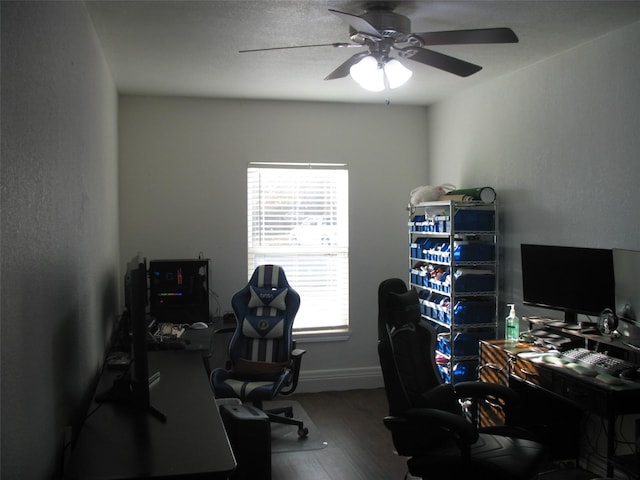 home office featuring hardwood / wood-style floors and ceiling fan