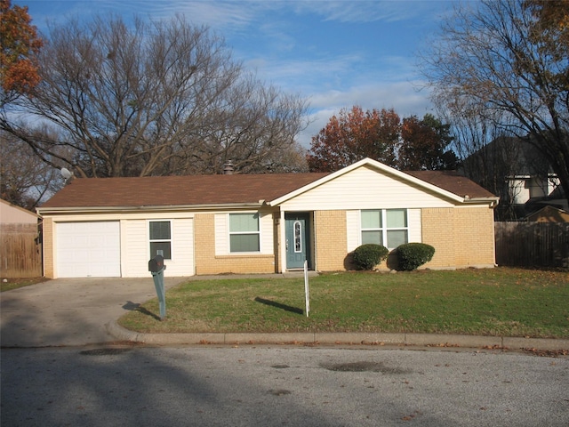 ranch-style house with a garage and a front yard