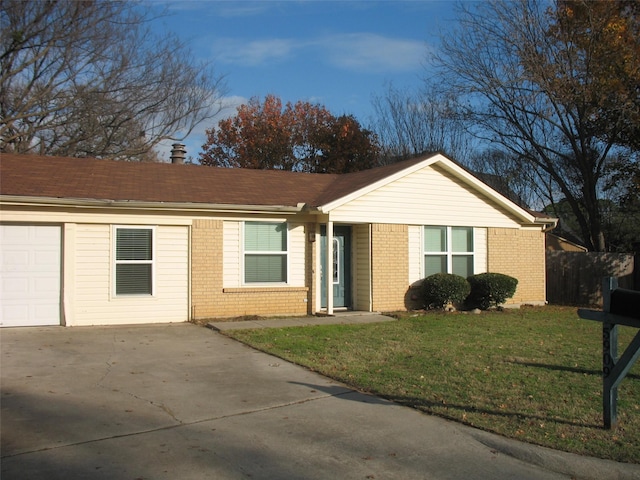 ranch-style home featuring a garage and a front yard