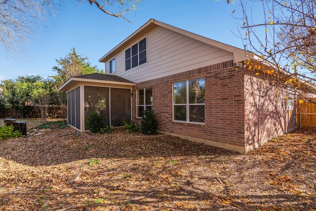 back of house with a sunroom