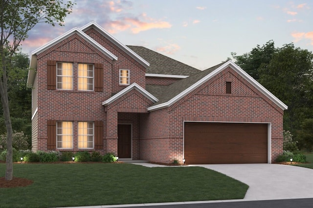 view of property featuring a yard and a garage