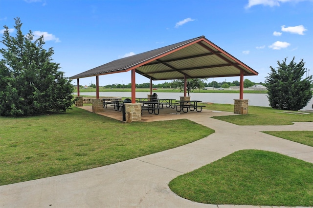 view of home's community featuring a gazebo, a water view, and a lawn