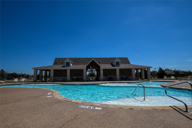 view of swimming pool with a patio area