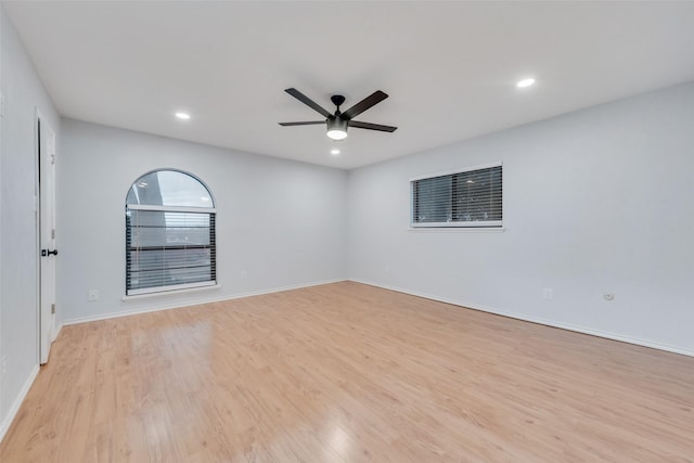 spare room featuring light hardwood / wood-style floors and ceiling fan