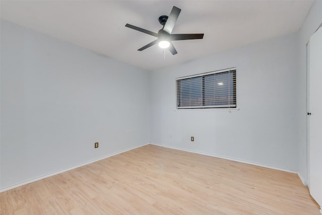 empty room featuring ceiling fan and light hardwood / wood-style flooring