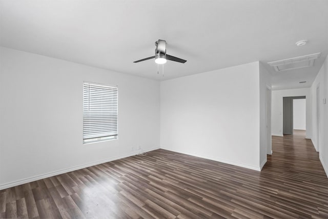 spare room featuring dark hardwood / wood-style floors and ceiling fan