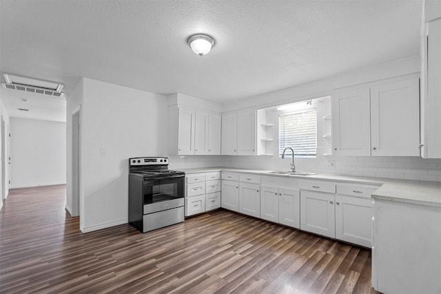 kitchen with electric range, sink, dark wood-type flooring, a textured ceiling, and white cabinets