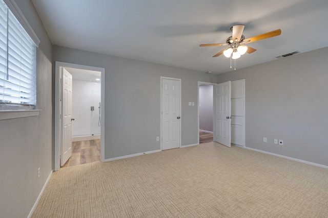 unfurnished bedroom featuring ceiling fan