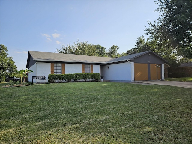 single story home featuring a front yard and a garage